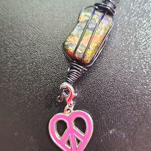 Handcrafted necklace with stone that brings peace and longevity